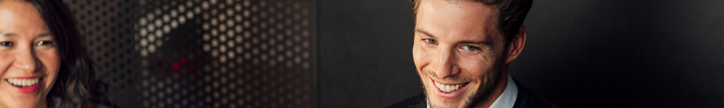 woman and man in conversation in an office