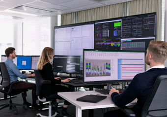man working in front of computers on trading floor